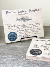 Your birth certificate printed on wood.